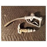 Vintage gasoline pump nozzle and a barrel tap Vintage gasoline pump nozzle and a barrel tap