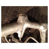Vintage gasoline pump nozzle and a barrel tap Vintage gasoline pump nozzle and a barrel tap