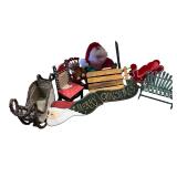 Collection of Christmas Decor Items Including Santa Figure, Chairs, Sleighs, and Holiday Sign