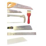 Collection of Hand Saws, Ruler, and Scraper Tool