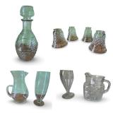 Collection of Vintage Cut Glassware Including Decanter, Pitchers, and Shade Covers