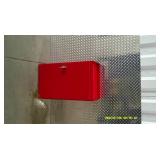 Red metal wall mount storage cabinet or first aid kit.
