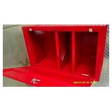 Red metal wall mount storage cabinet or first aid kit.