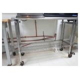NSF Stainless Steel Counter with rack on wheels 53" long by 23" wide by 39" tall NSF Stainless Steel Counter with rack on wheels 53" long by 23" wide by 39" tall