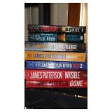 Covered Tote of Paperback, Hardcover Books.