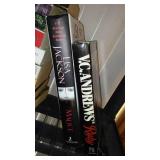 Covered Tote of Paperback, Hardcover Books.