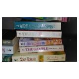 Covered Tote of Paperback, Hardcover Books.