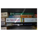 Covered Tote of Paperback, Hardcover Books.