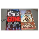 Covered Tote of Paperback, Hardcover Books.