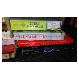 Covered Tote of Paperback, Hardcover Books.