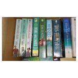 Covered Tote of Paperback, Hardcover Books.