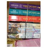 Covered Tote of Paperback, Hardcover Books.