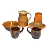 Assorted Artisan Pottery Collection with Bowls, Mugs, and Pitcher