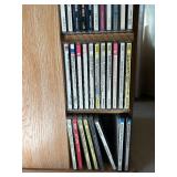 Rotating Media Storage Tower with Assorted CDs and Box Sets