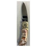 Collection of 6 John Wayne Commemerative Knife Sets and 1 Cowboy Knife Collection of 6 John Wayne Commemerative Knife Sets and 1 Cowboy Knife