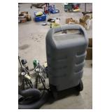 Garage and Camping Utility Lot with Jack Stands, Blue Jug, Sleeping Bag, and Tools