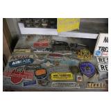 Collection of Vintage Metal Signs, Badges, and License Plates