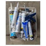 Assorted Plumbing Supplies with Caulk, Sealants, and Tools Assorted Plumbing Supplies with Caulk, Sealants, and Tools