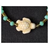 Trio of Jewelry: Surgical Steel Key Navel Ring, Charm Bangle, Turtle Beaded Bracelet Trio of Jewelry: Surgical Steel Key Navel Ring, Charm Bangle, Turtle Beaded Bracelet