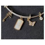 Trio of Jewelry: Surgical Steel Key Navel Ring, Charm Bangle, Turtle Beaded Bracelet Trio of Jewelry: Surgical Steel Key Navel Ring, Charm Bangle, Turtle Beaded Bracelet