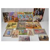 Assorted Vintage-Style Tin Advertising and Movie Signs Assorted Vintage-Style Tin Advertising and Movie Signs