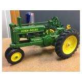 4 John Deere Cast Tractors Including Nice ERTL Model A 4 John Deere Cast Tractors Including Nice ERTL Model A