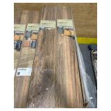 TRAFFIC MASTER - Lot of 42 - LAKE SHORE PECAN - 7 MM - 7.64" X 50.63" (24.17 sq ft per box) (1,009.76 sq ft total) TRAFFIC MASTER - Lot of 42 - LAKE SHORE PECAN - 7 MM - 7.64" X 50.63" (24.17 sq ft per box) (1,009.76 sq ft total)