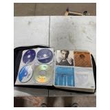CD CASE FULL OF CDS CD CASE FULL OF CDS