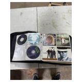 CD CASE FULL OF CDS CD CASE FULL OF CDS