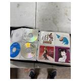 CD CASE FULL OF CDS CD CASE FULL OF CDS