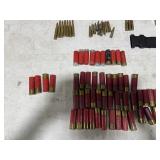 TABLE FULL OF 12 GUAGE, 16 GAUGE, 270 REM, 308 REM, 7.62X39, & AMMO CASE TABLE FULL OF 12 GUAGE, 16 GAUGE, 270 REM, 308 REM, 7.62X39, & AMMO CASE