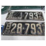 Antique Wrench and License Plates.