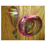 Colorful wind spinners and suet fee...