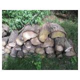 Cascading line of stacked firewood ...