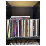Large Collection of Assorted Music CDs with Tall CD Shelf
