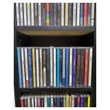 Large Collection of Assorted Music CDs with Tall CD Shelf