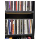 Large Collection of Assorted Music CDs with Tall CD Shelf