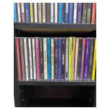 Large Collection of Assorted Music CDs with Tall CD Shelf