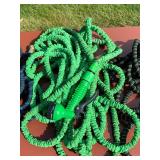 Assortment of Garden Hoses and Sprayers (5 Pieces)