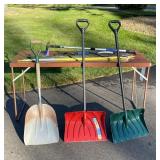 Lot of Snow Shovels, Car Snow Brushes, and Driveway Marking Stakes