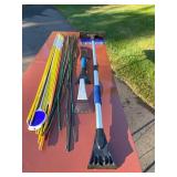 Lot of Snow Shovels, Car Snow Brushes, and Driveway Marking Stakes