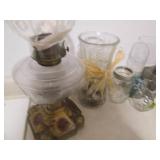 Vintage oil lamp, stones and home d...