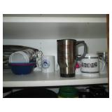 Cupboard filled with dishes and kit...