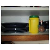 Cupboard filled with dishes and kit...