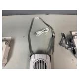 Three Portable Rechargeable Neck Fans. USB Charging Cable Included. The fans also have a clip and will stand on flat service.