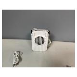 Three Portable Rechargeable Neck Fans. USB Charging Cable Included. The fans also have a clip and will stand on flat service.