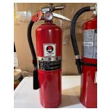 Two Charged Fire Extinguishers