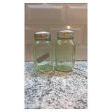 Pair of Vintage Ribbed Vaseline Glass Uranium Shakers with Metal Lids