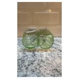 Pair of Vintage Ribbed Vaseline Glass Uranium Shakers with Metal Lids