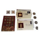 A mix of different coins and stamps, including a special silver German coin from 1874. A mix of different coins and stamps, including a special silver German coin from 1874.
